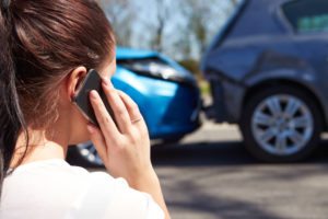 Woman on the phone after minor accident